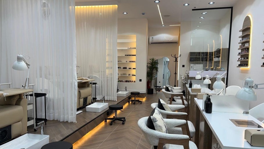 Elegant interior of Diva beauty shop in Riyadh, Riyadh Province, SA featuring stylish manicure stations.