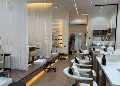 Elegant interior of Diva beauty shop in Riyadh, Riyadh Province, SA featuring stylish manicure stations.