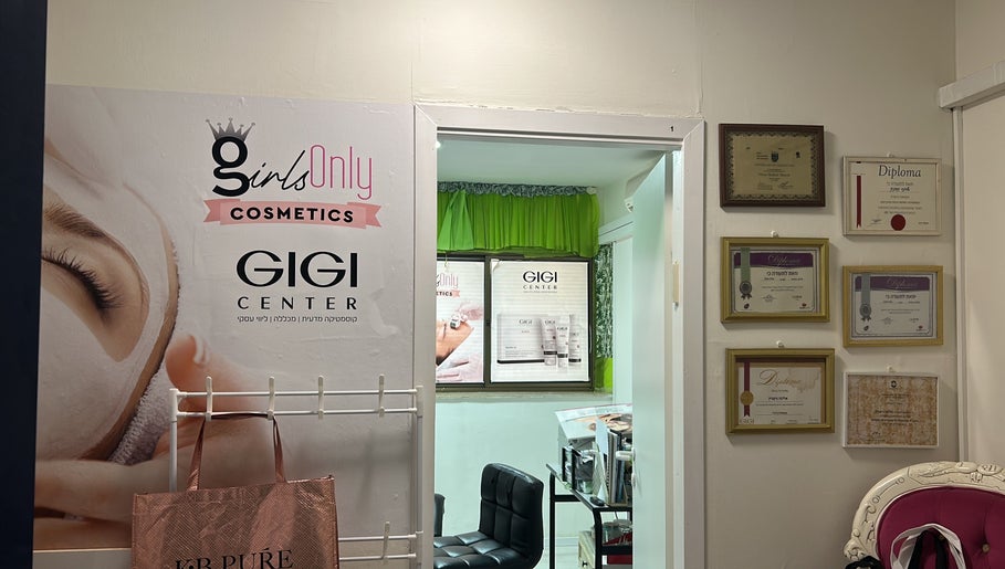 Interior view of Girls Only Cosmetics by Alina Nisnik, Ra'anana, Center District, IL with diplomas and signage.