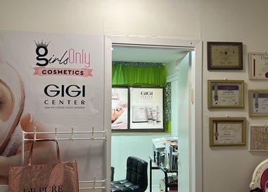 Interior view of Girls Only Cosmetics by Alina Nisnik, Ra'anana, Center District, IL with diplomas and signage.