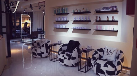 Modern salon interior at M hair and beauty, لوسيل, بلدية الضعاين, QA with stylish seating and product displays.