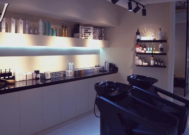 Modern salon interior at M hair and beauty in لوسيل, بلدية الضعاين, QA, showcasing hair washing stations.