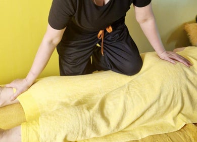 Therapist performing a Thai massage at Ying Yang Thai Massage, Aberdeen, Scotland, GB.