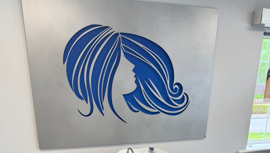 Blue silhouette of a woman's hair on display at Gary Sedgwick, Clitheroe, England, GB.
