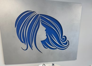 Blue silhouette of a woman's hair on display at Gary Sedgwick, Clitheroe, England, GB.