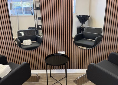 Elegant salon setup at Gary Sedgwick in Clitheroe, England, GB featuring mirrors and black styling chairs.
