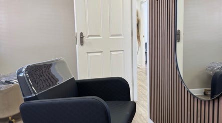 Modern salon chair and mirror at Gary Sedgwick in Clitheroe, England, GB, showcase stylish interior decor.