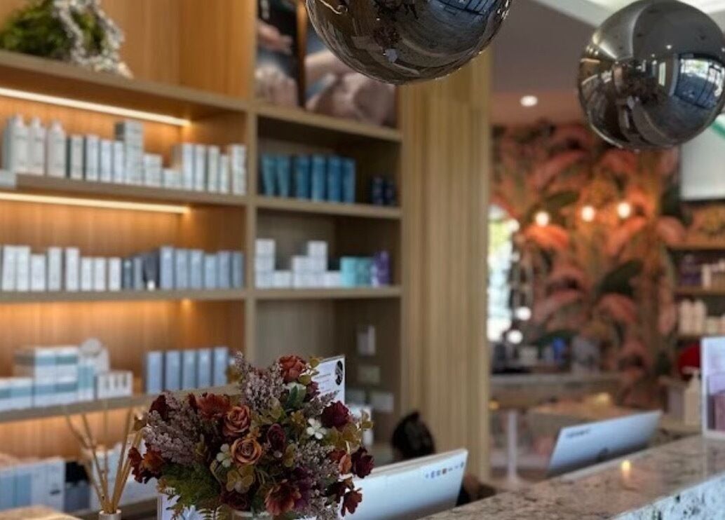 Routine Contour Clinic- Berwick, Melbourne's lush reception area, showcasing beauty products and floral decor.
