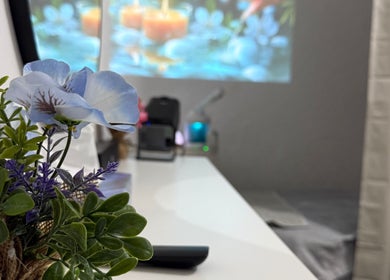 Serene spa room at Glam Onwheel, Leicester, England with fresh flowers and calming decor.