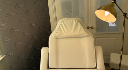 Relaxing aesthetic treatment chair at Without A Trace Aesthetics, Jarrow, England, GB with warm lighting.