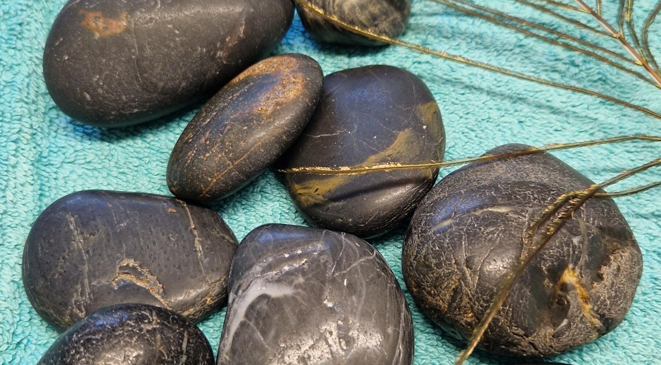 Relaxing hot stones at HealthyMindandSoul spa in Stourbridge, England, GB for rejuvenating wellness treatments.