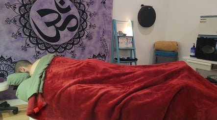 Relaxing massage setting at Playground For The Soul, Winston-Salem, North Carolina, US with calming decor.