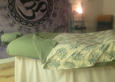 Peaceful massage room at Playground For The Soul, Winston-Salem, North Carolina, US with relaxing decor.