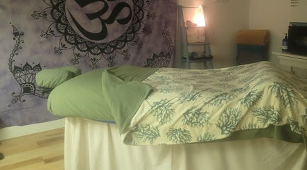 Peaceful massage room at Playground For The Soul, Winston-Salem, North Carolina, US with relaxing decor.