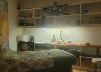 Cozy wellness room at Playground For The Soul, Winston-Salem, North Carolina, US, featuring a massage table.