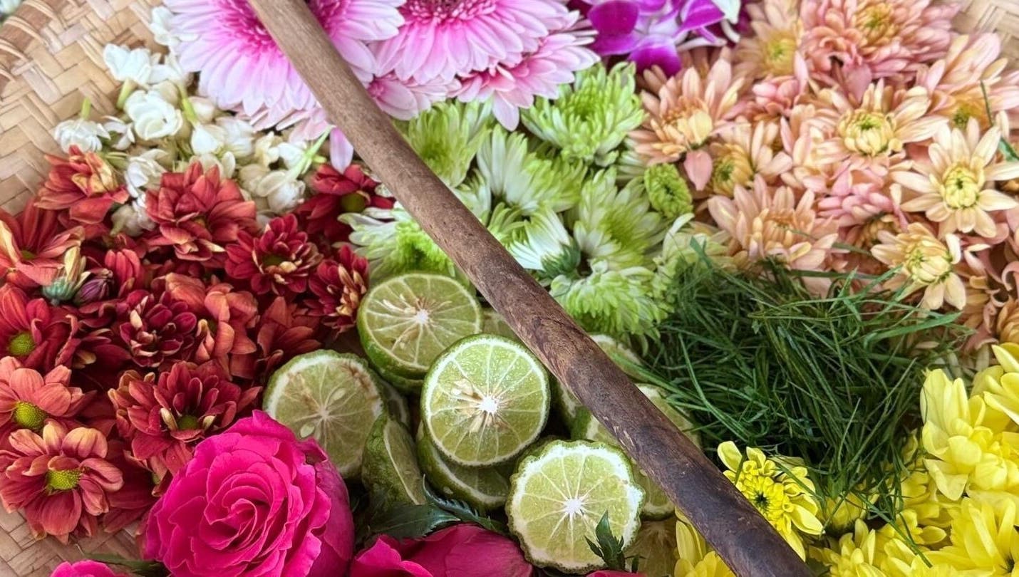 Vibrant flowers and sliced limes at Rainoura by Nurain Firdaus, Rawang, Selangor, MY enhancing wellness.