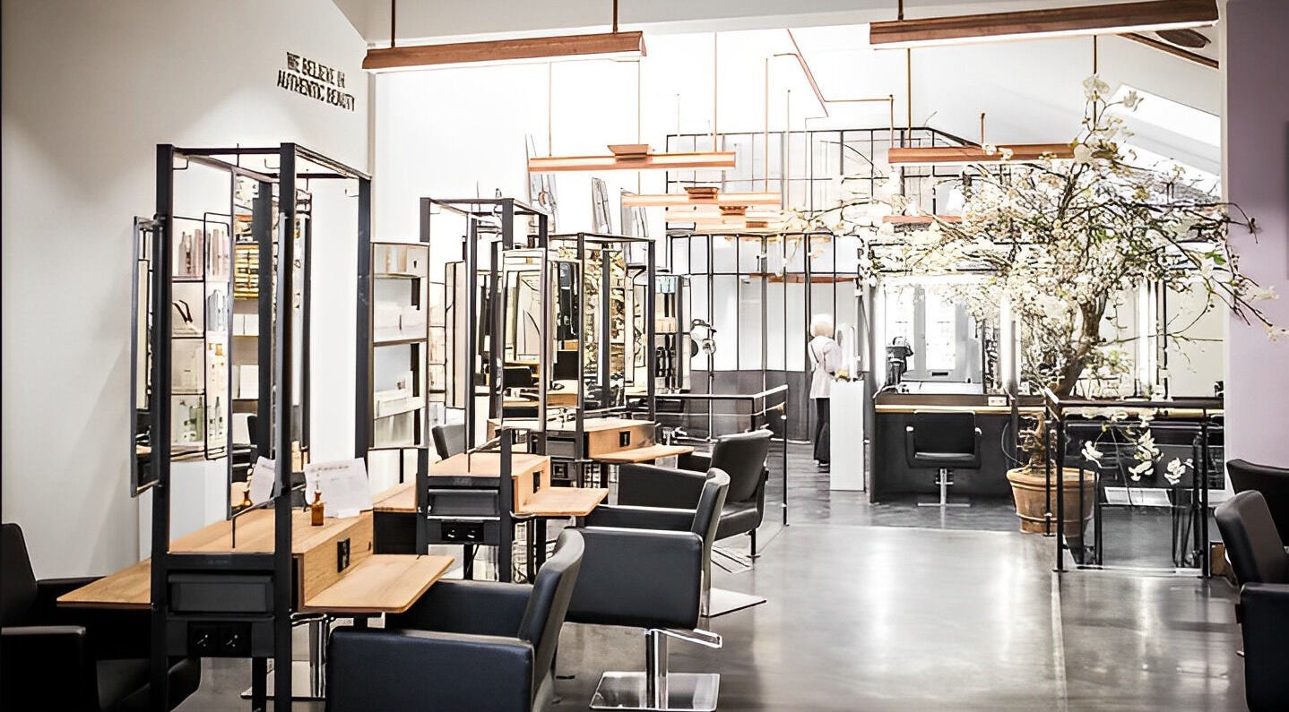 Stylish interior of Mogeen beauty salon in Amsterdam, Noord-Holland, NL with sleek design and lighting.