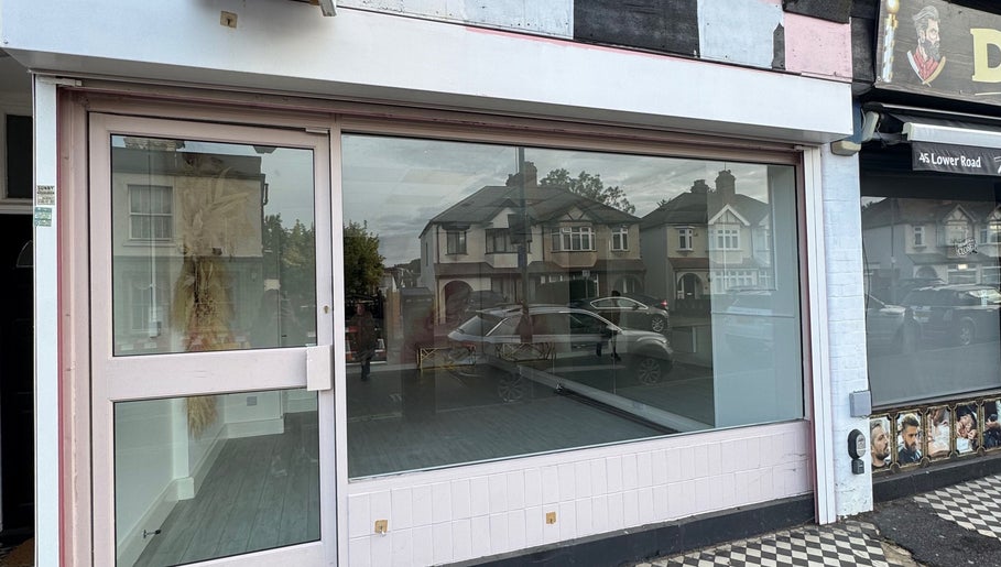Exterior view of Nova Head Spa in Sutton, England, GB, showcasing its modern glass storefront.