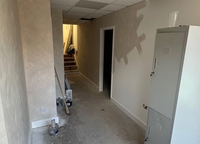 Nova Head Spa under renovation in Sutton, England, GB. Freshly painted hallway and lockers.