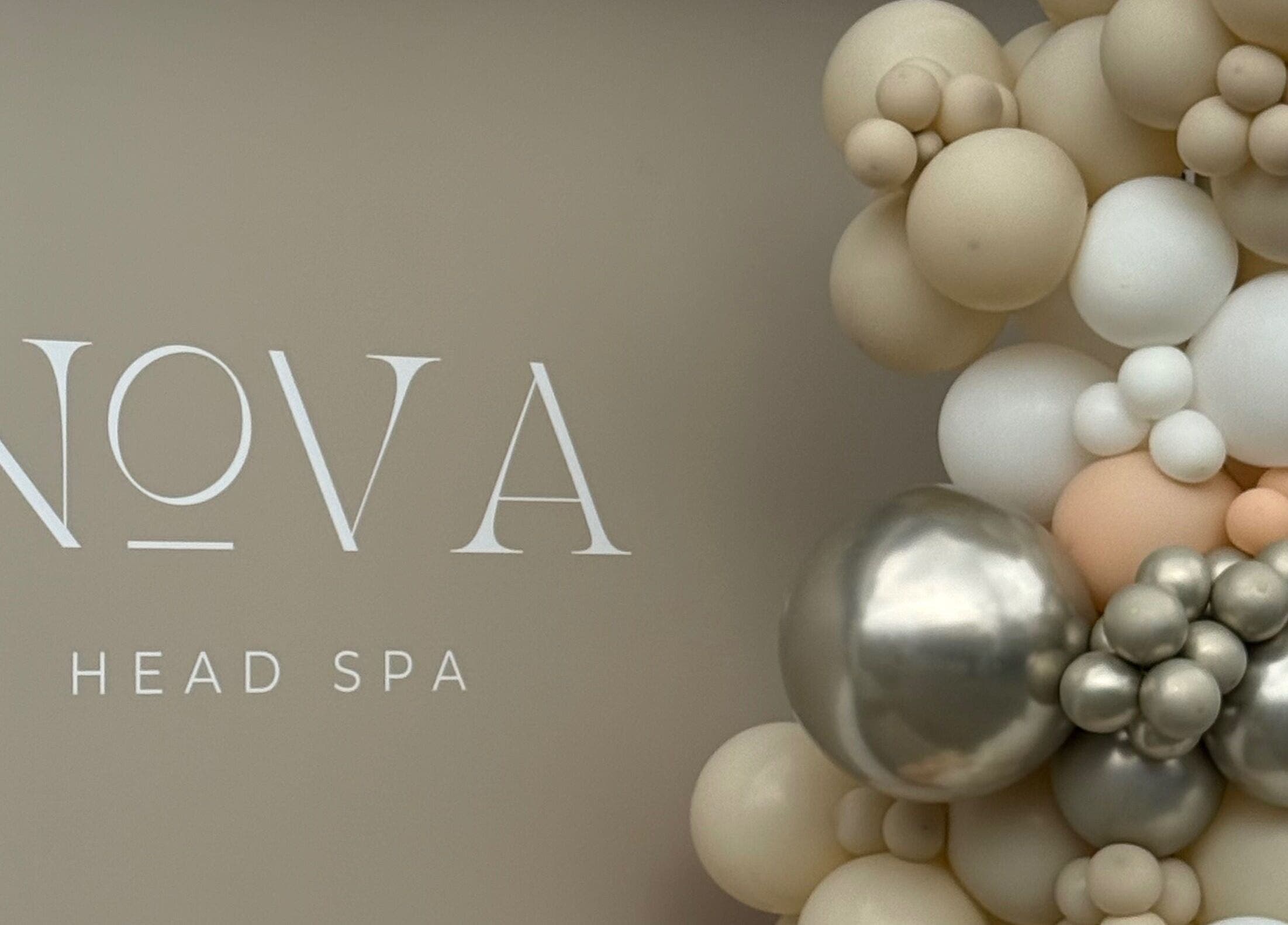 Nova Head Spa Sutton England GB with elegant balloon decor in neutral tones for a grand opening.