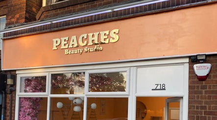 Exterior of Peaches Beauty Studio in Nottingham, England, GB with its distinctive peach signage.
