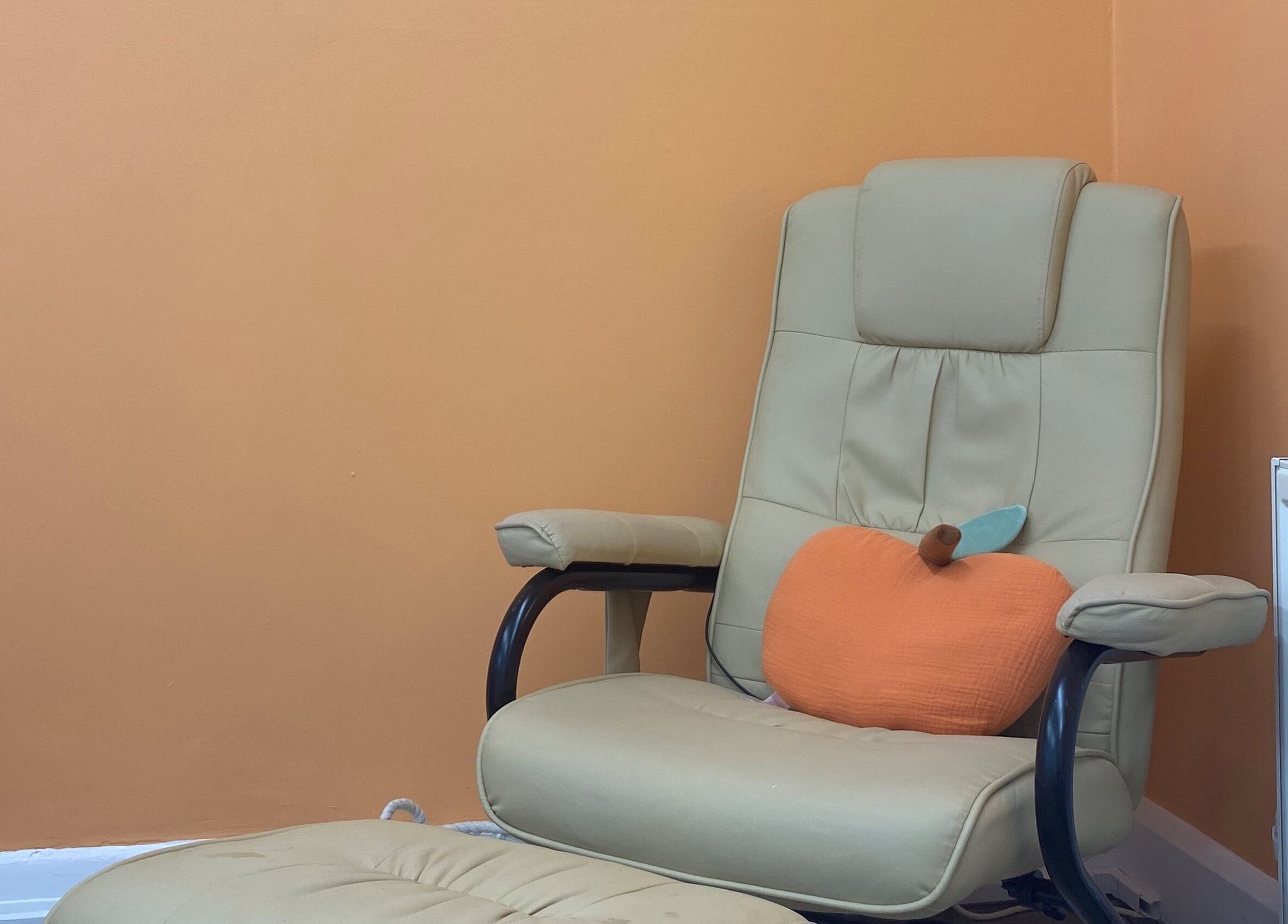 Relaxing chair with peach cushion at Peaches Beauty Studio, Nottingham, England, GB.