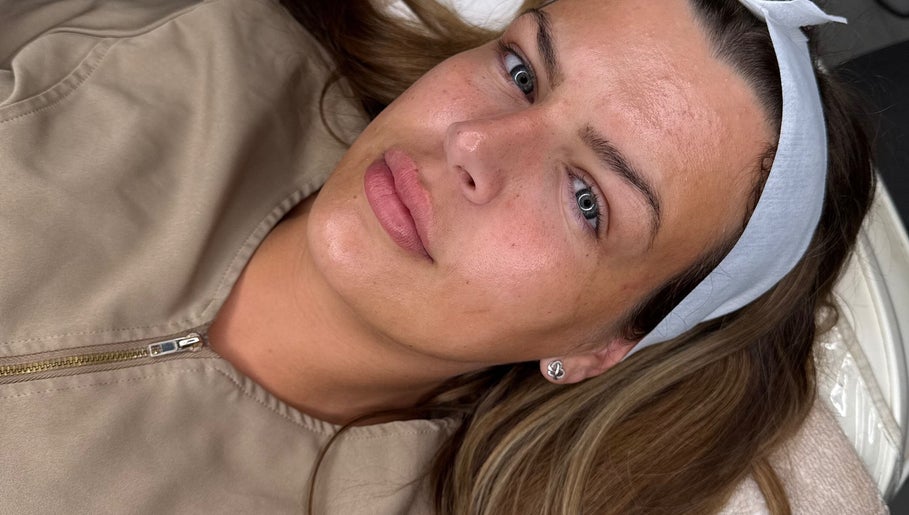 Relaxed woman enjoying rejuvenating facial at Your Dream Glow, Manchester, England, GB.