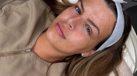 Relaxed woman enjoying rejuvenating facial at Your Dream Glow, Manchester, England, GB.