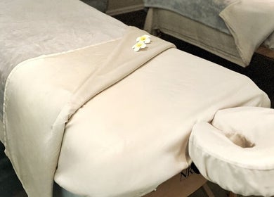 Luxurious massage table at Mantra Thai Massage & Spa, Vienna, Virginia, US, offering relaxation and wellness.