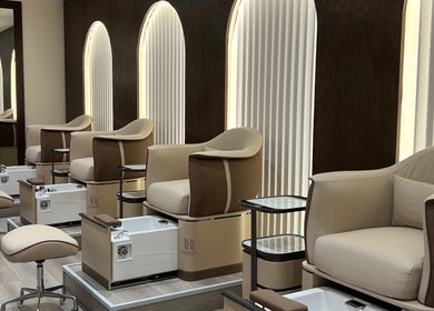 Luxurious pedicure chairs at Razor Roast in Los Angeles, California, US, showcasing modern design and comfort.