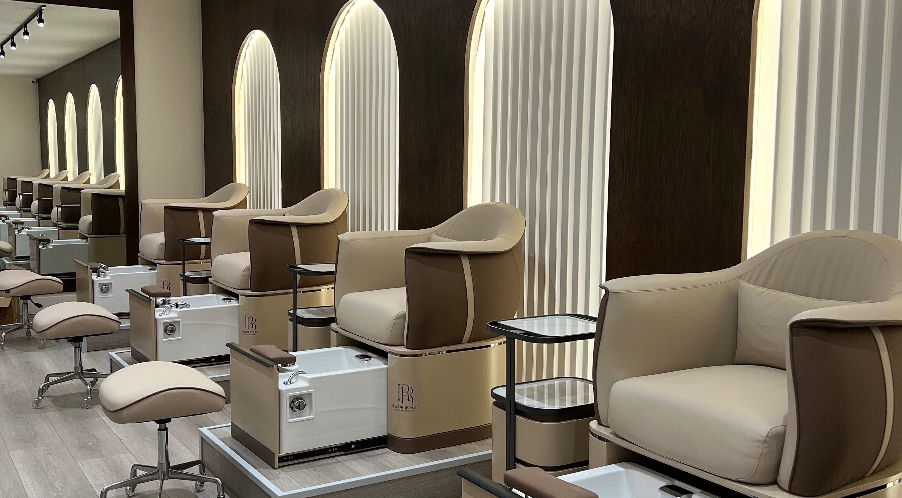 Luxurious pedicure chairs at Razor Roast in Los Angeles, California, US, showcasing modern design and comfort.