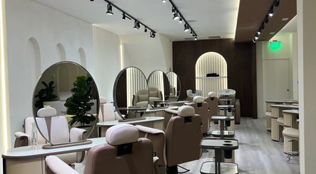 Chic Razor Roast salon interior in Los Angeles, California, US with modern mirrors and plush chairs.