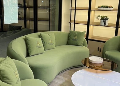 Elegant green seating area at Razor Roast in Los Angeles, California, US with modern décor and cozy cushions.