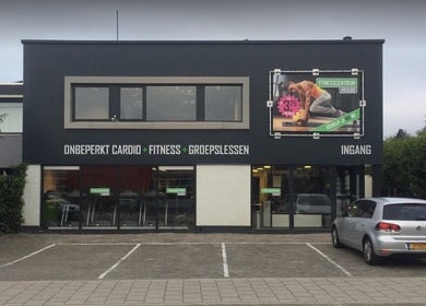 Front view of Hair Master Heiloo venue in Heiloo, Noord-holland, NL, showing parking area and entry.