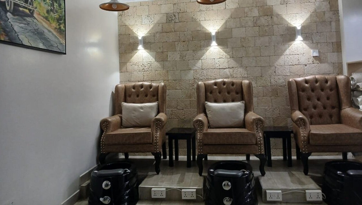 Comfortable pedicure chairs in Carys Salon, Barber and SPA, Nairobi, Nairobi County, KE, creating a chic atmosphere.