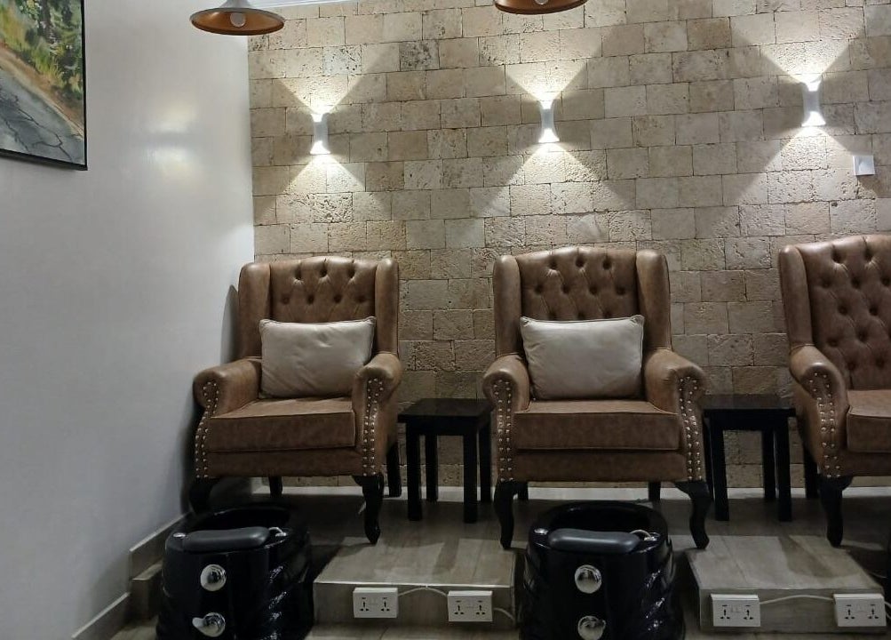 Comfortable pedicure chairs in Carys Salon, Barber and SPA, Nairobi, Nairobi County, KE, creating a chic atmosphere.