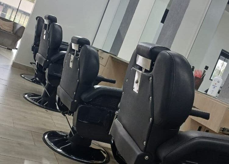 Modern barber chairs at Carys Salon, Barber and SPA, Nairobi, Nairobi County, KE, offering luxury grooming.