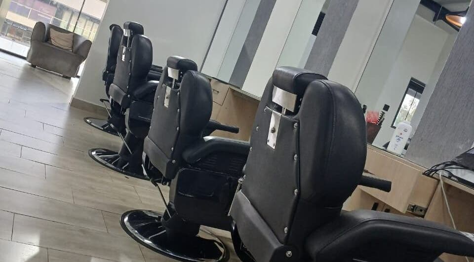 Modern barber chairs at Carys Salon, Barber and SPA, Nairobi, Nairobi County, KE, offering luxury grooming.