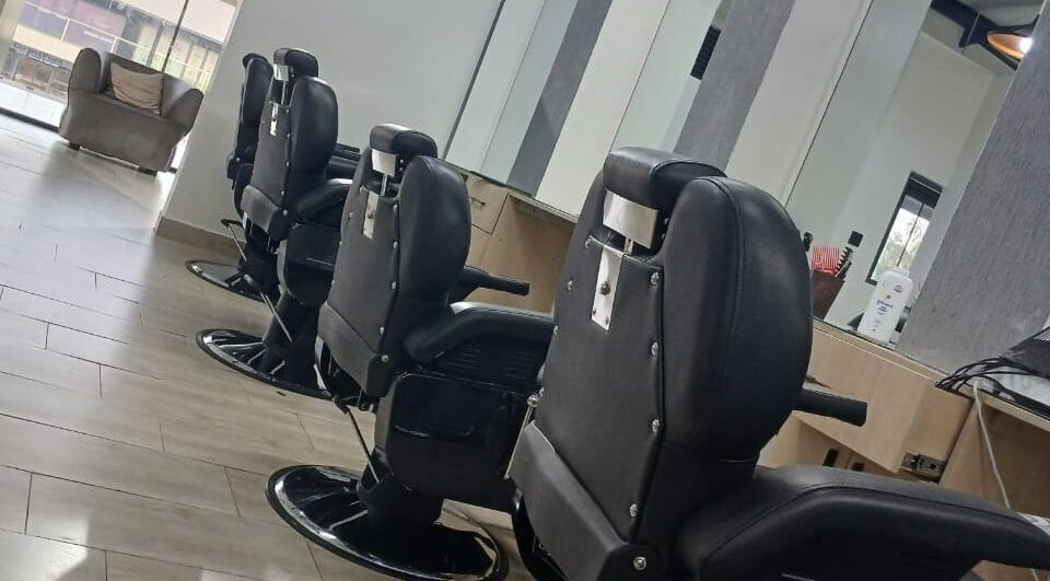 Modern barber chairs at Carys Salon, Barber and SPA, Nairobi, Nairobi County, KE, offering luxury grooming.
