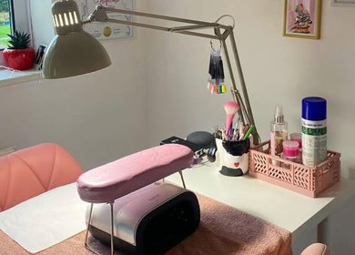 Elegant nail setup at Soph Does Nails, Yate, England, GB with pink accents and tools.