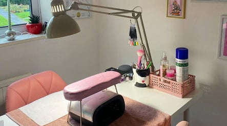 Elegant nail setup at Soph Does Nails, Yate, England, GB with pink accents and tools.