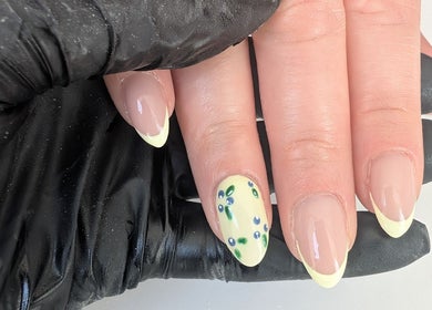 Elegant floral French manicure by Beauty by Blue in Farsley, England, GB, showcasing nail art mastery.