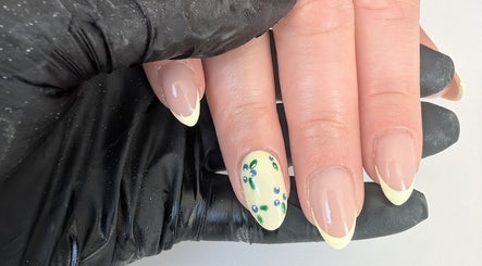 Elegant floral French manicure by Beauty by Blue in Farsley, England, GB, showcasing nail art mastery.