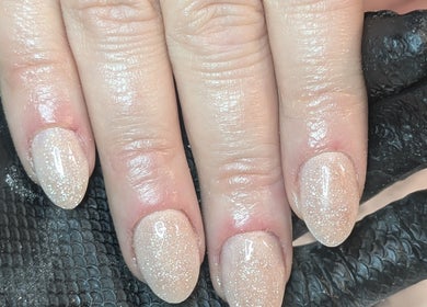 Sparkling glitter nails at Beauty by Blue, Farsley, England, GB. Showcasing elegant nail artistry.