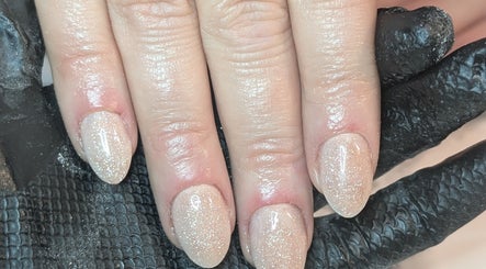 Sparkling glitter nails at Beauty by Blue, Farsley, England, GB. Showcasing elegant nail artistry.