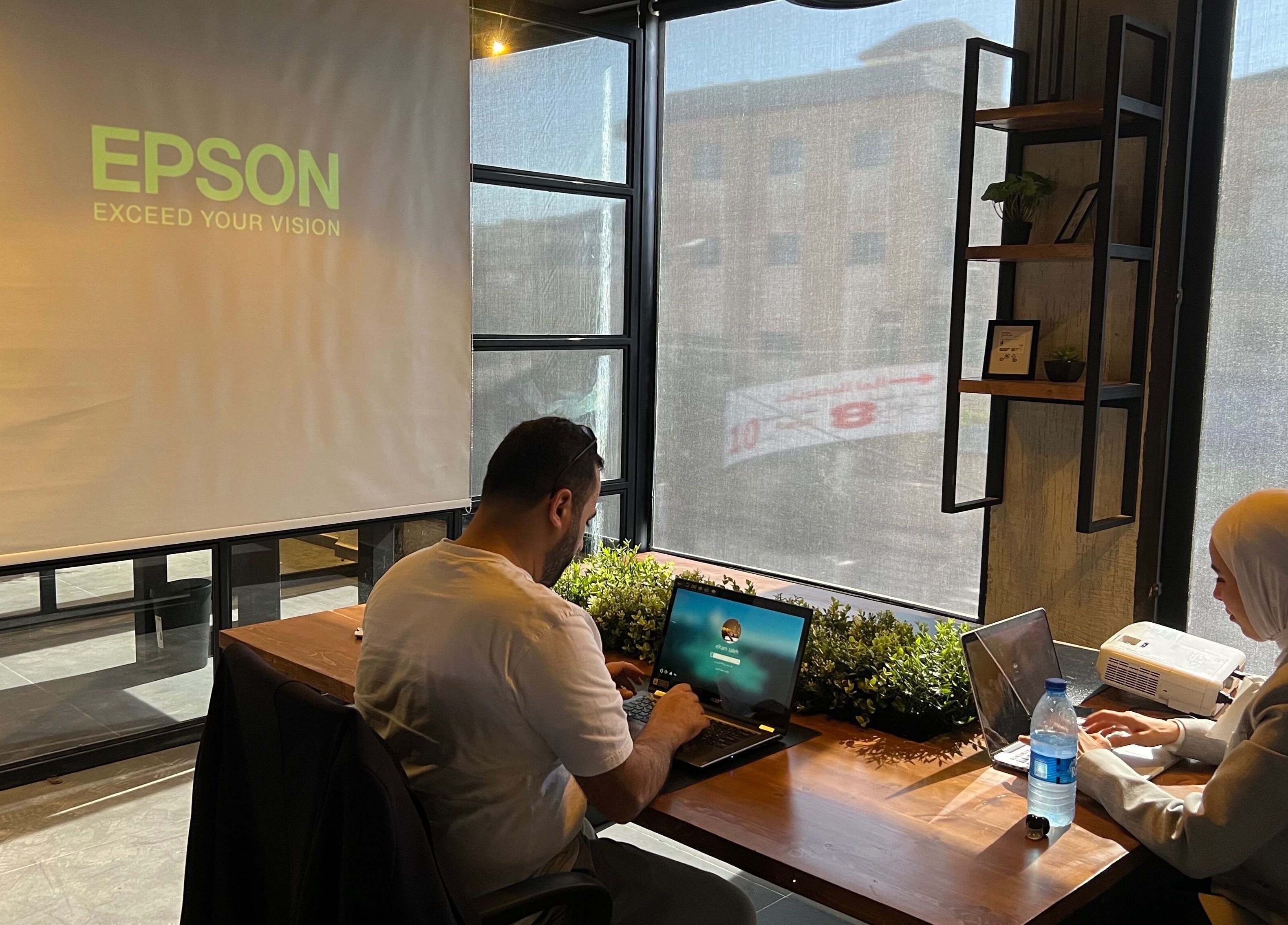 People working in a modern office at Spaces offices, Az-zarqa, Zarqa Governorate, JO with natural light.