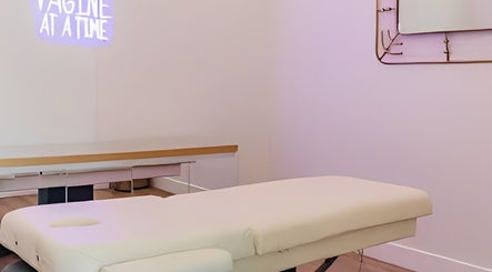 Relaxing treatment room at The OG Brazilianaire Studio in Spanish Fork, Utah, US with massage table and decor.