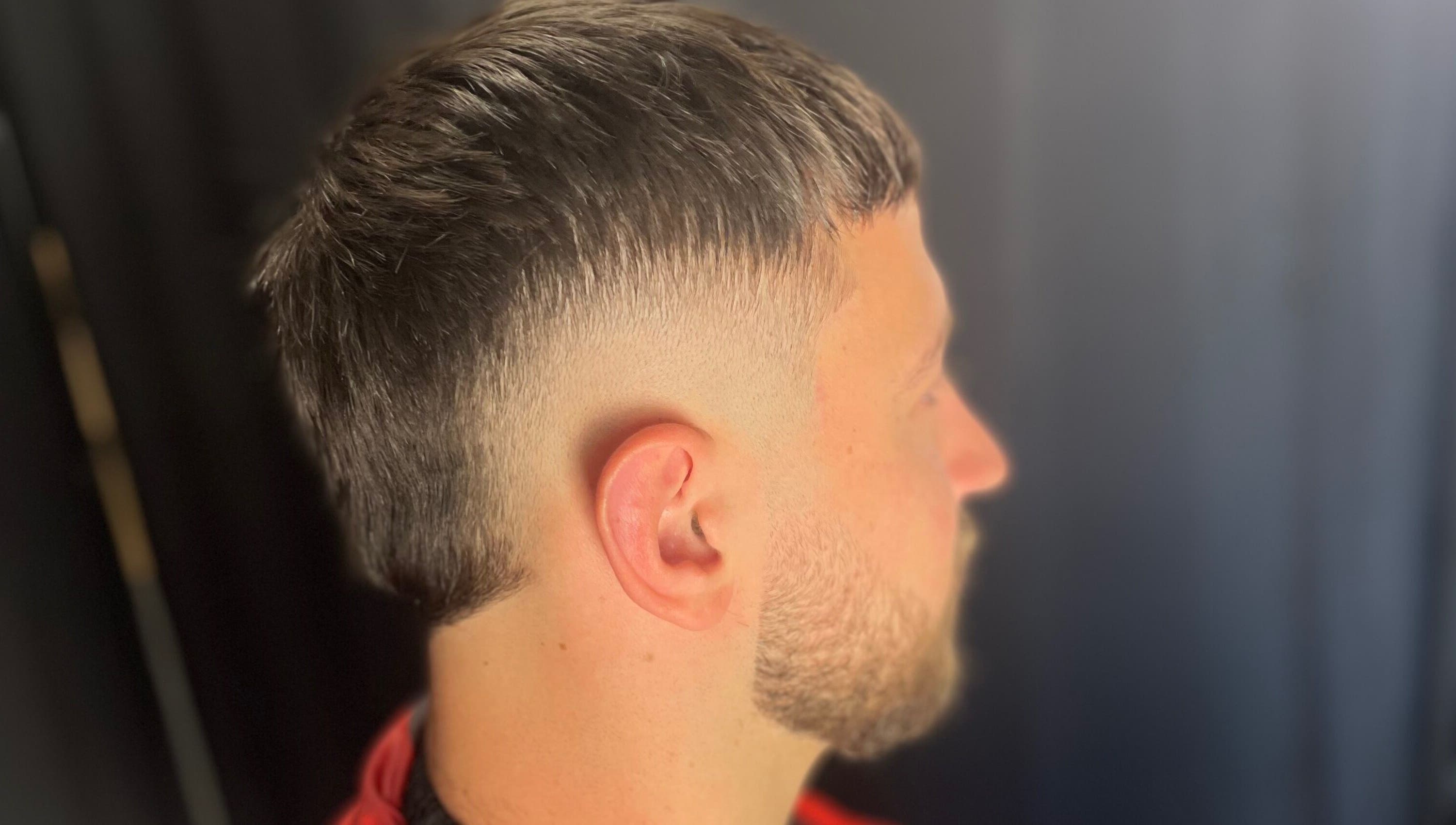 A stylish side fade haircut at EFRO CUTS, Melbourne, Victoria, AU showcasing modern grooming.