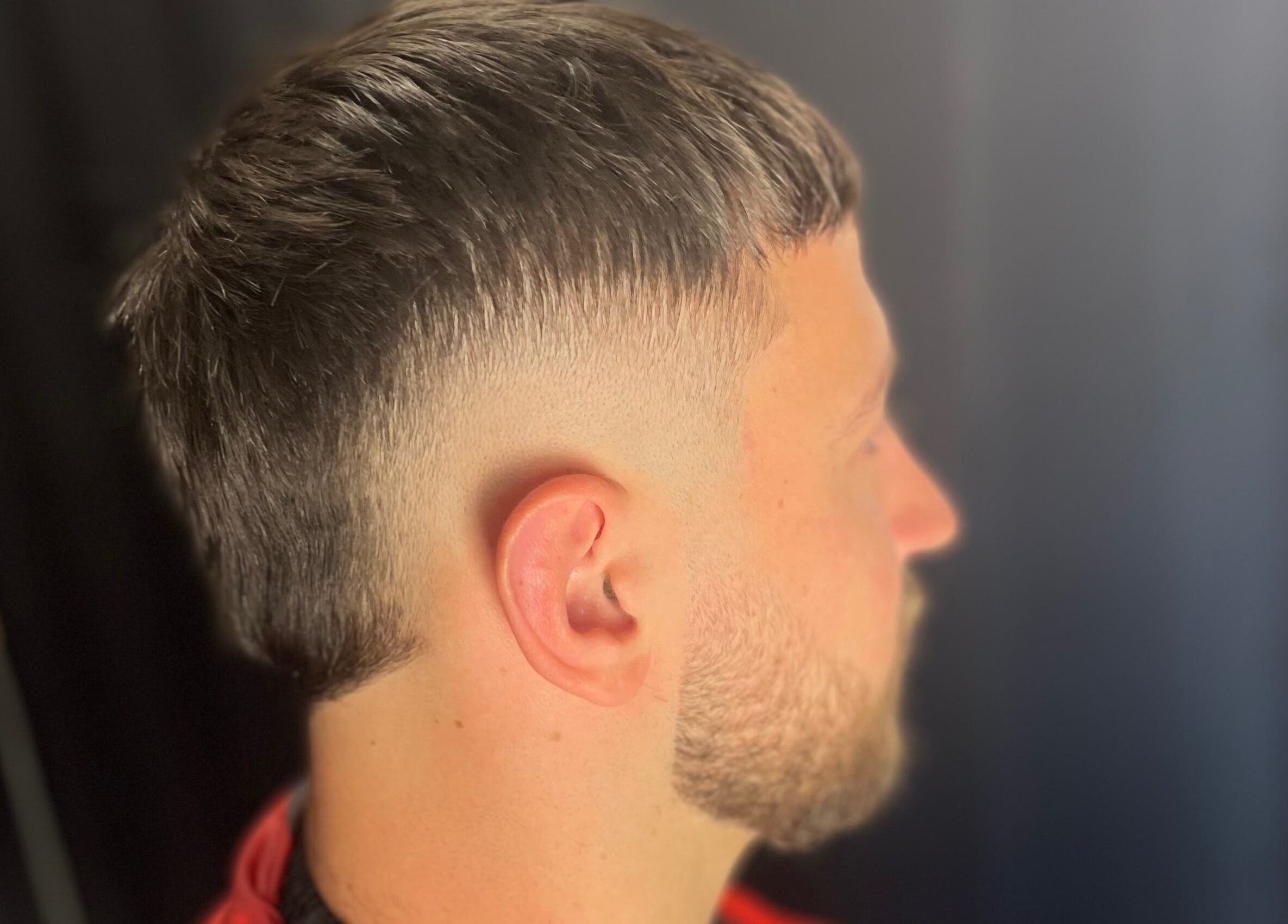 A stylish side fade haircut at EFRO CUTS, Melbourne, Victoria, AU showcasing modern grooming.