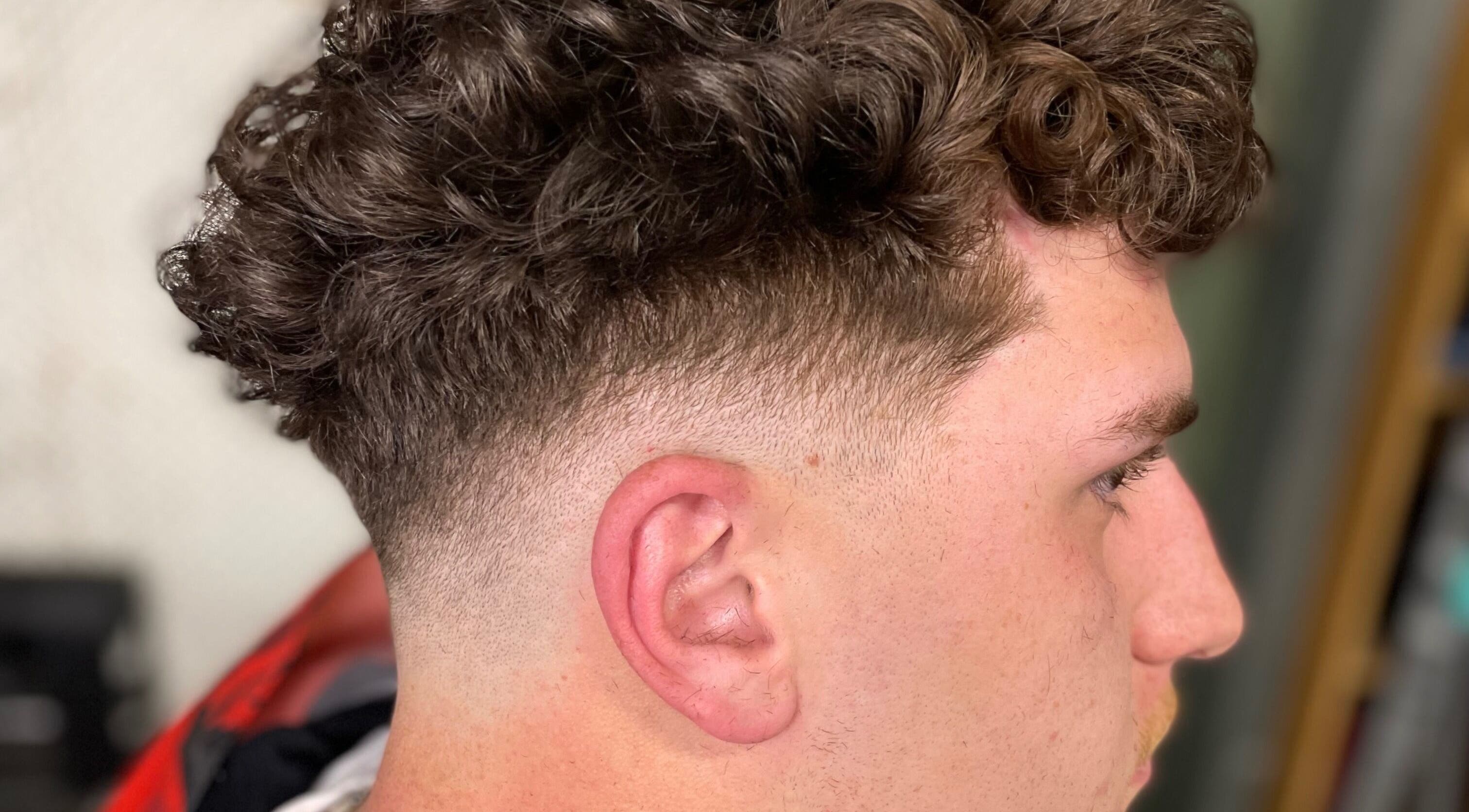 Close-up of a trendy curly fade haircut at EFRO CUTS, Melbourne, Victoria, AU.